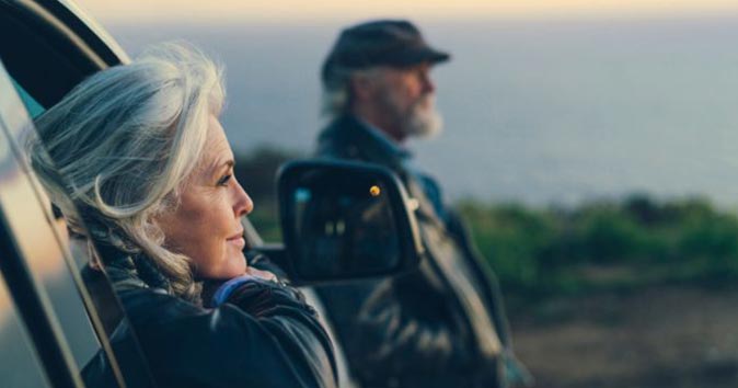 woman with gray hair gazing wistfully