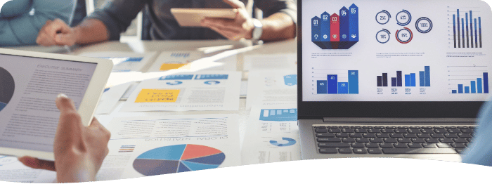 a table covered with printout of charts