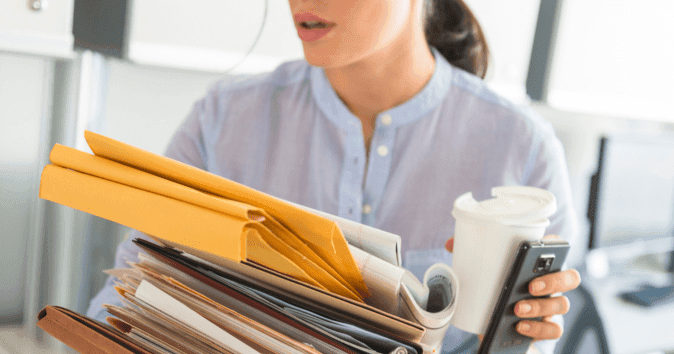 busy woman carrying too much