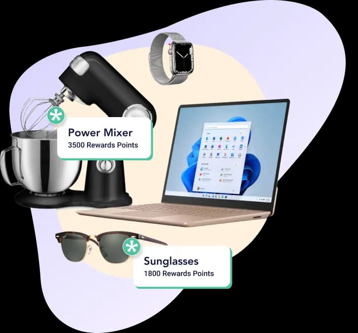 An assortment of reward items displayed, including a power mixer labeled with "3500 Rewards Points," a laptop showing a Windows interface, wristwatch, and sunglasses marked with "1800 Rewards Points." The items are arranged in a visually appealing manner against a soft pastel background.