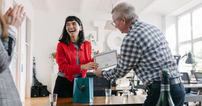 manager giving the employee a certificate