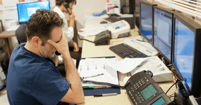stressed employee holding phone